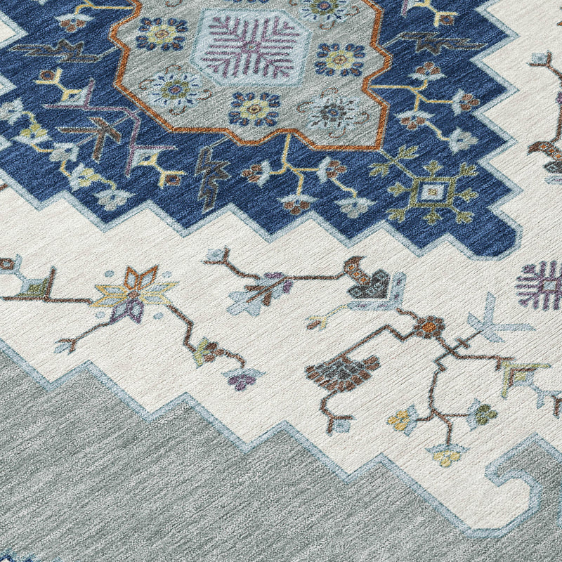 Geometric rug surface close-up with blue medallion and ivory star motifs