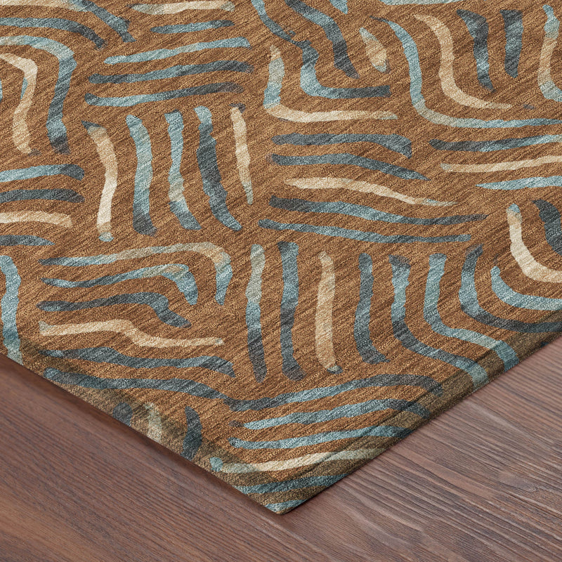 Corner view of orange and teal abstract rug with wavy lines on wood floor