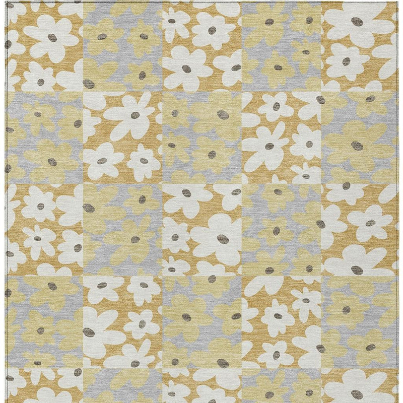 Top view floral patchwork area rug in gold, ivory, and gray squares