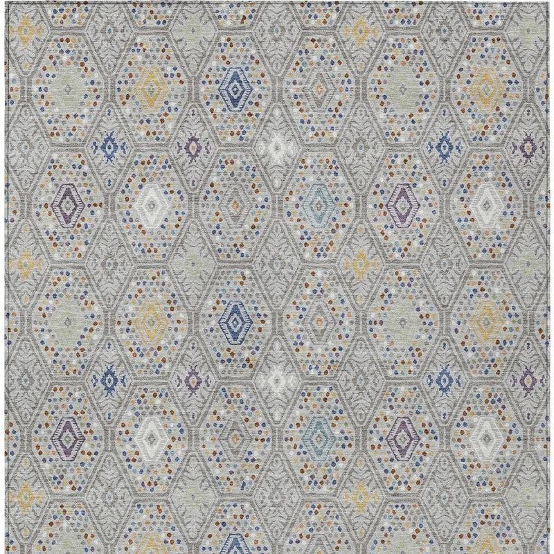 Geometric area rug pattern with multicolor hexagons and dotted accents on light gray
