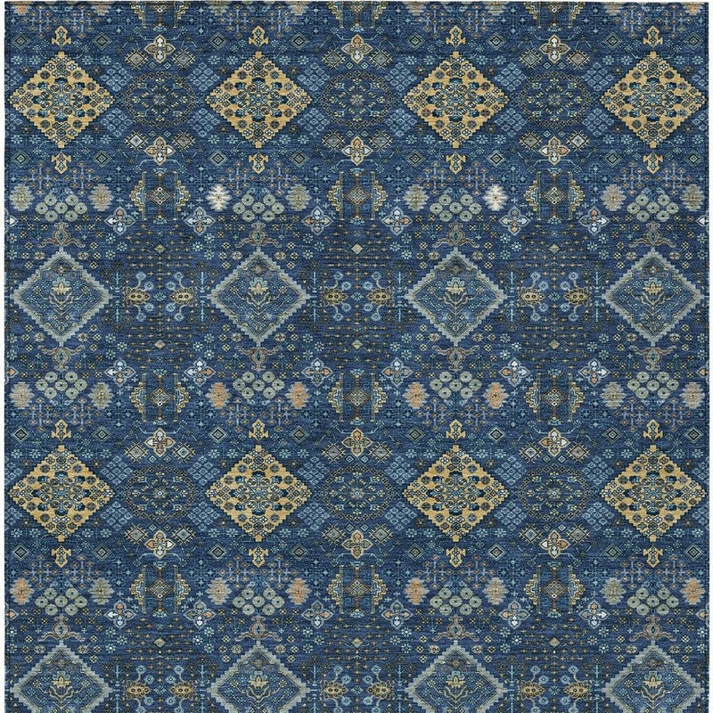 Navy blue and gold geometric area rug close-up with repeating diamond designs