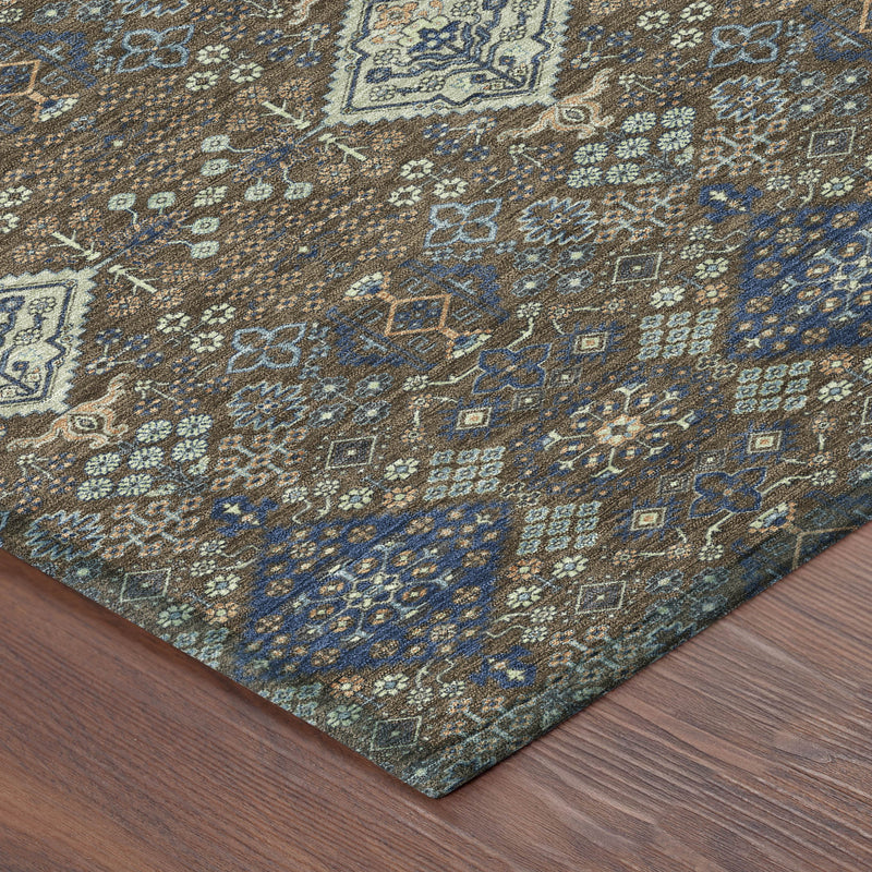 Geometric area rug corner showing textured pattern in brown and blue with cream accents