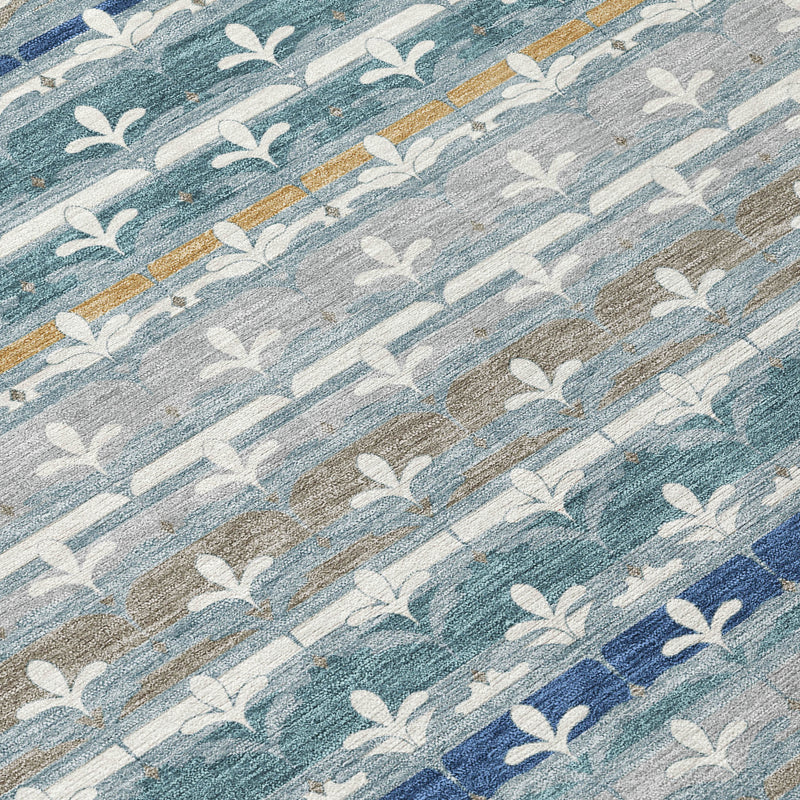 Close-up teal blue and ivory damask area rug with leaf motifs and rustic woven texture