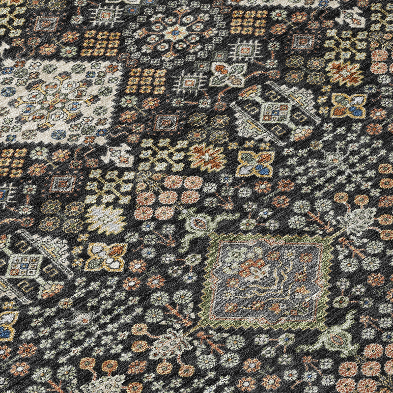 Geometric area rug with dark charcoal and black base, multicolor motif pattern