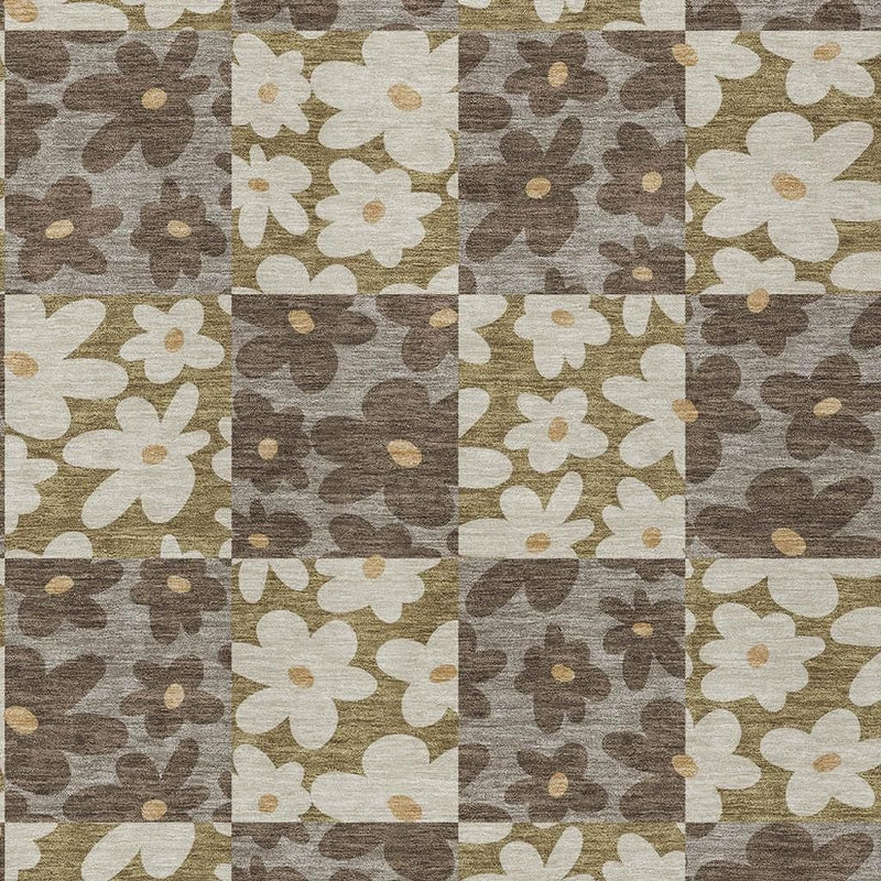Patchwork floral area rug in brown, gray, tan, and cream blocks