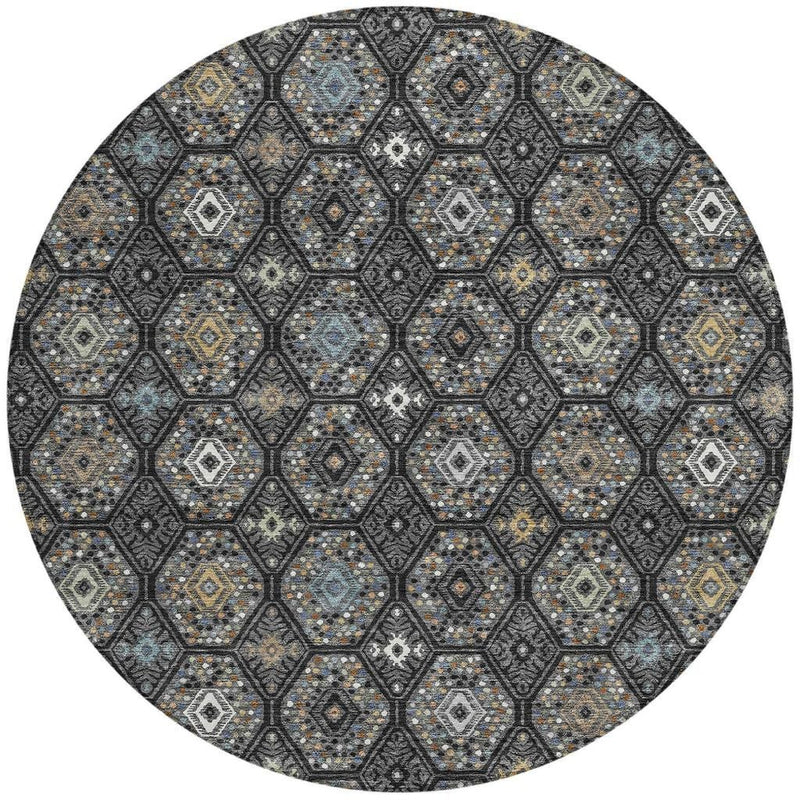 Round area rug with dark charcoal lattice, light gray diamond motifs, and small gold accents