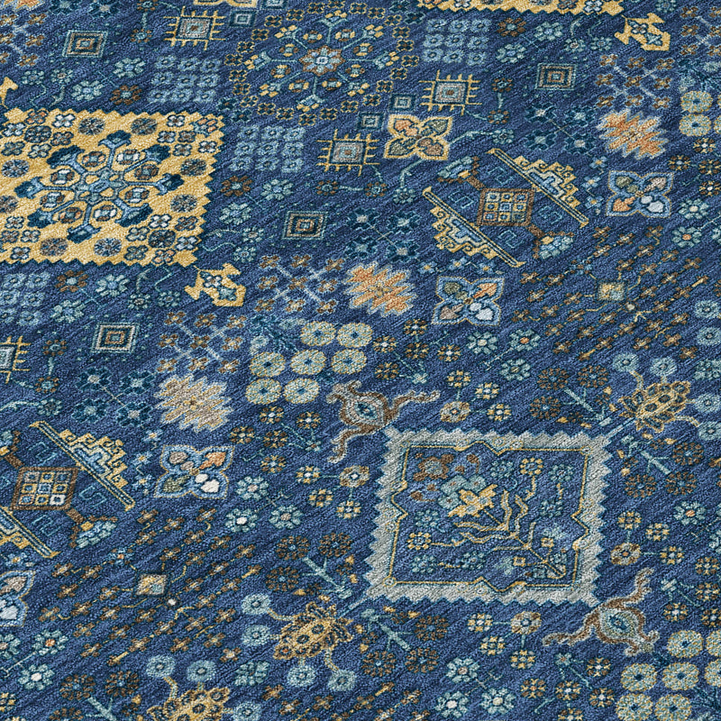 Navy blue and gold geometric pattern round area rug, close-up texture view.