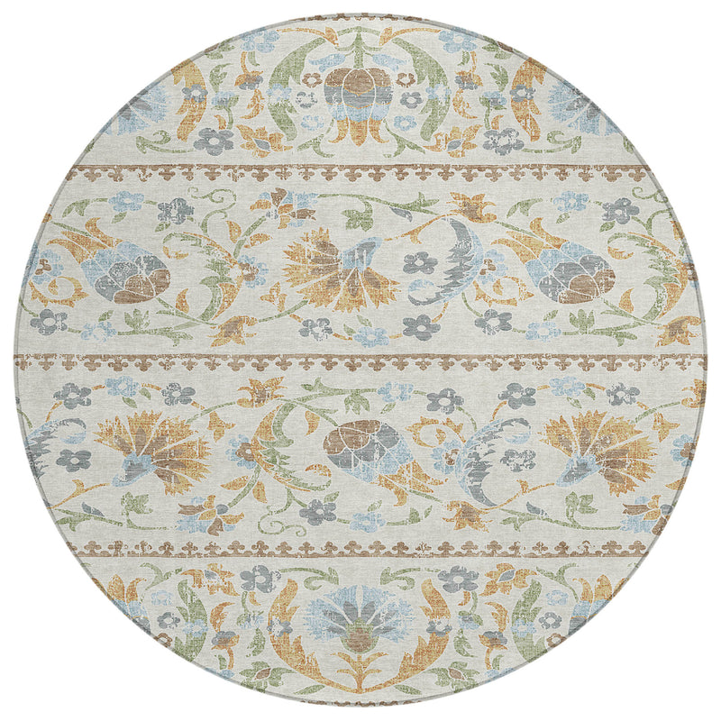 Round area rug with multicolor bird, floral, and scroll border pattern on an ivory base