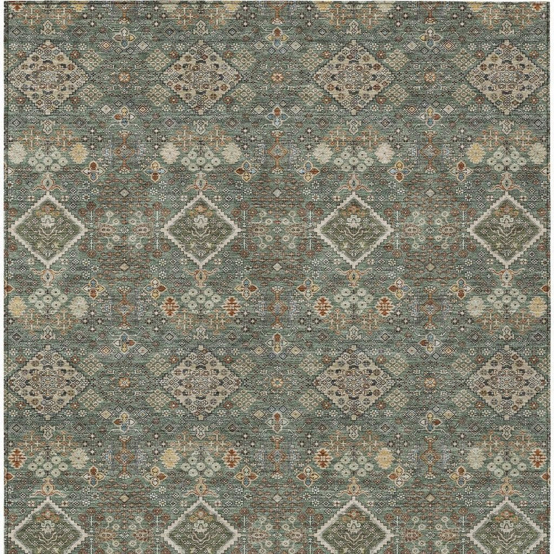 Geometric area rug with teal-green and taupe medallion motifs and dotted detailing