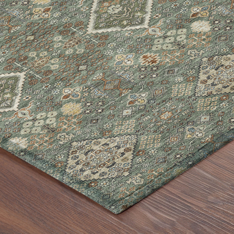 Geometric area rug corner with teal-green and taupe pattern and detailed border edge