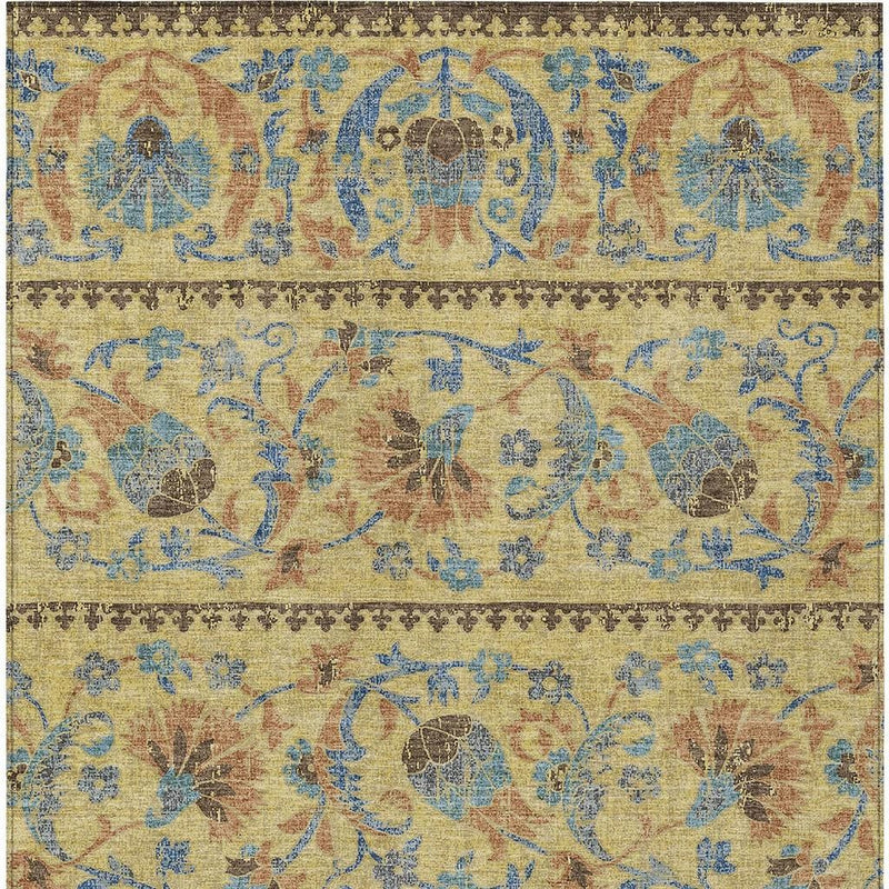 Distressed floral area rug pattern in gold, teal blue, and brown with ornate motifs