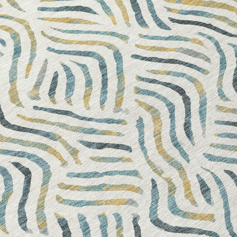 Ivory rug close-up with curved wavy line pattern in blue, gold, and olive