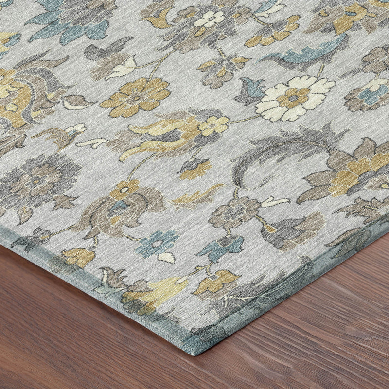 Light gray floral rug corner with blue and yellow scroll and flower details.