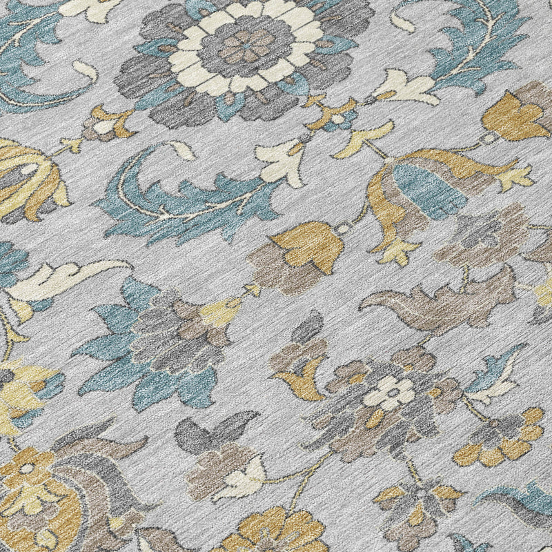 Floral area rug detail in light gray with blue flowers, gray outlines, and yellow accents.