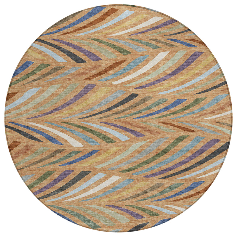 Round abstract indoor outdoor area rug with tan, blue and green wavy stripes