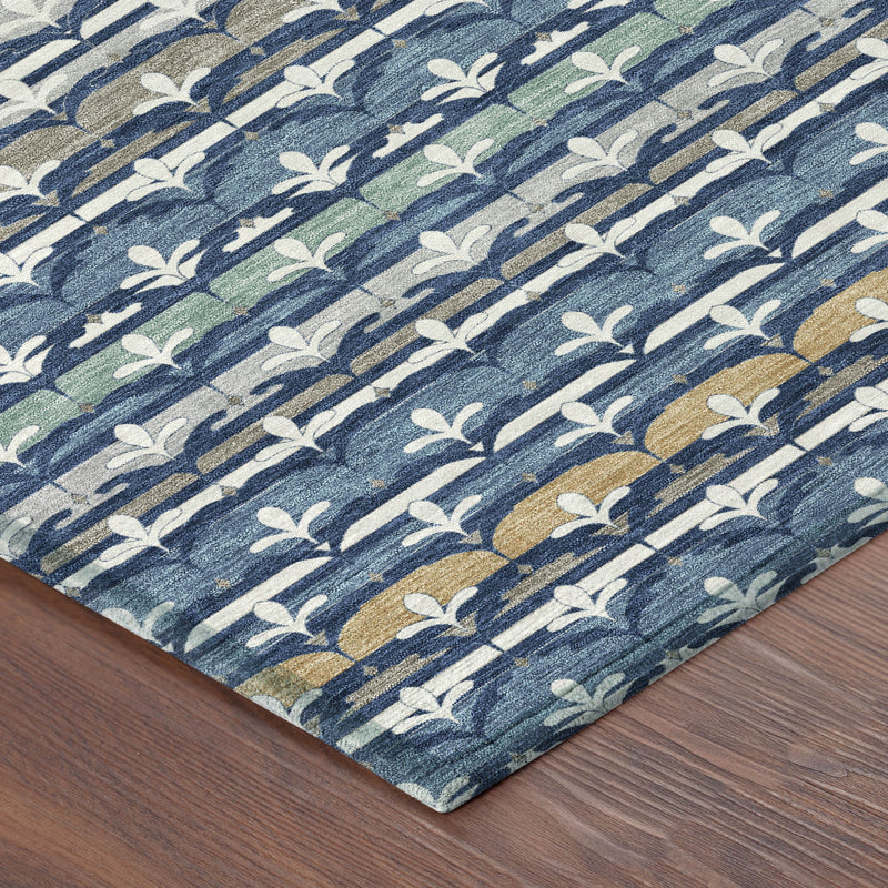Corner view of navy and blue area rug with fleur-de-lis damask and gold highlights