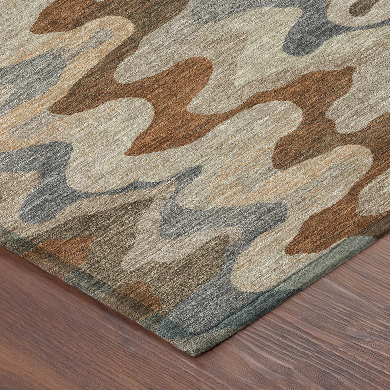 Corner view of round area rug with textured abstract zigzag pattern in multicolor tones