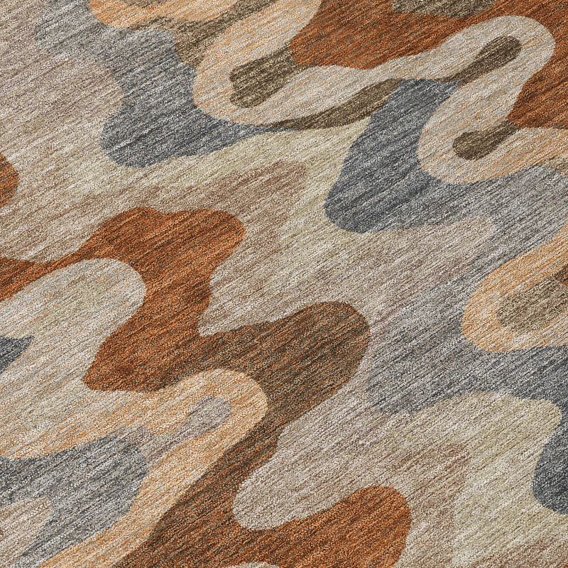 Abstract rug texture close-up with wavy block shapes in tan, brown, orange, and gray