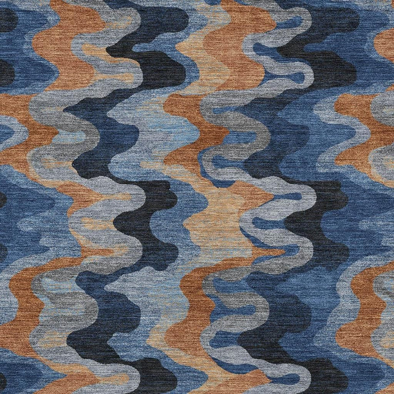 Indoor/outdoor area rug close-up wavy zigzag abstract pattern in dark blue and tan