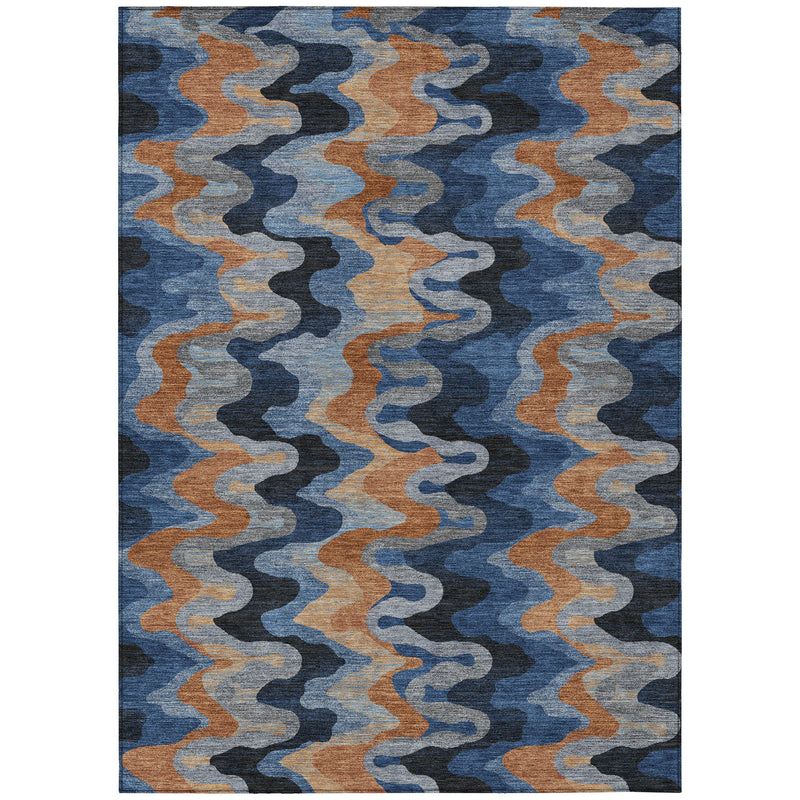Indoor/outdoor area rug with abstract zigzag pattern in blue, black, and tan