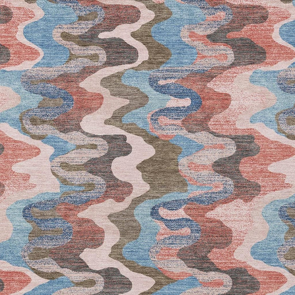 Multicolor abstract zigzag area rug with pink, coral, blue, and gray wavy pattern.