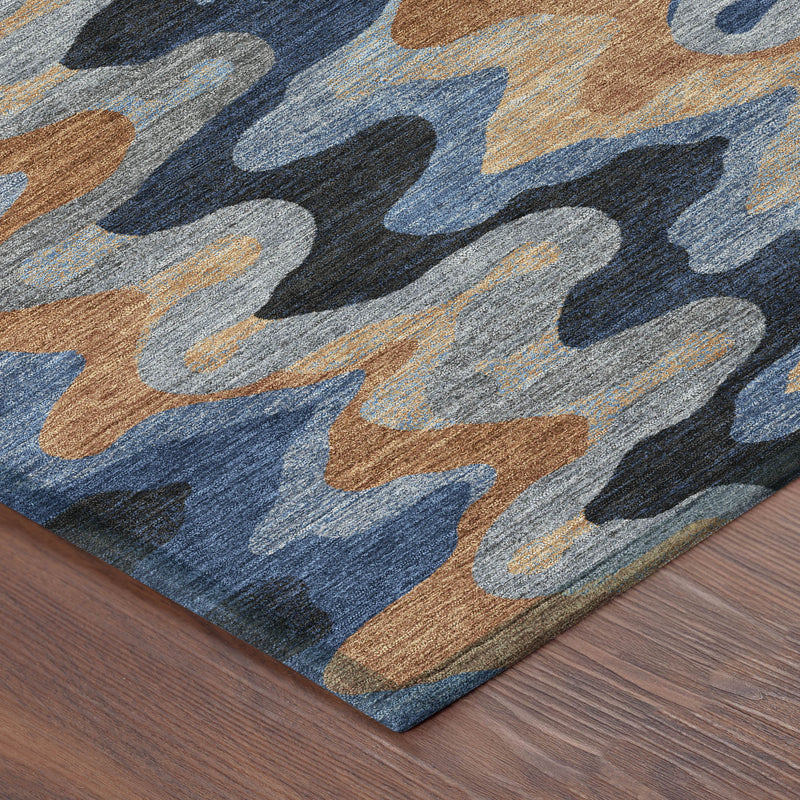 Corner detail of abstract indoor/outdoor area rug with navy zigzags and tan accents