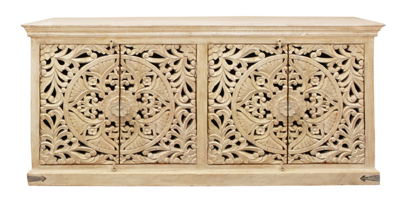 Beige distressed sideboard front with two pairs of ornate carved doors and center divider.