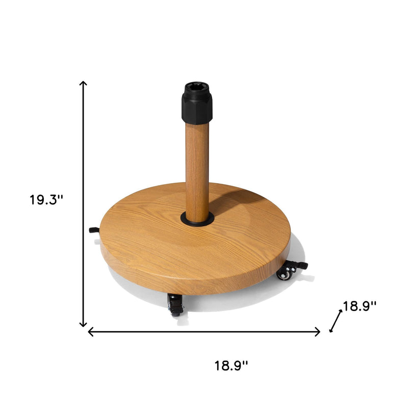 Round light brown umbrella base with wood center pole and four caster wheels