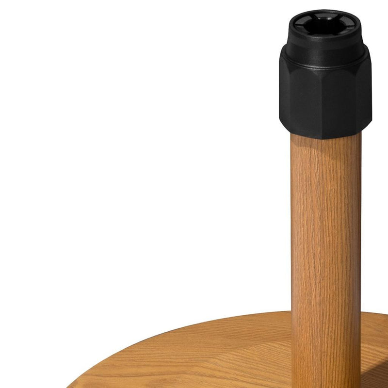 Light brown umbrella base with black cap on center pole and round wood base