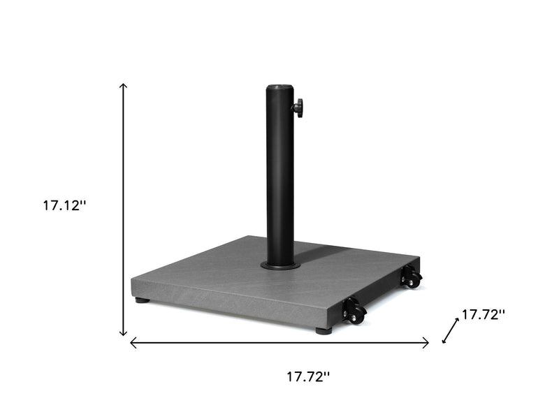 Umbrella base stand with tall black pole and gray square base on caster wheels