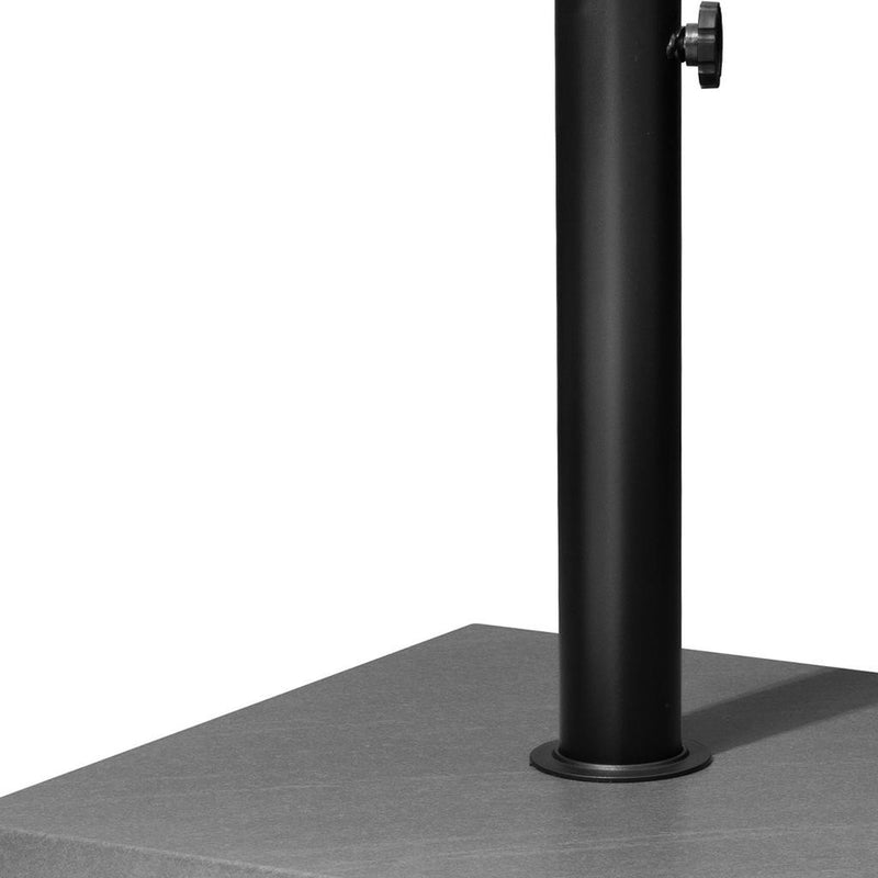 Tall black umbrella post on gray square base