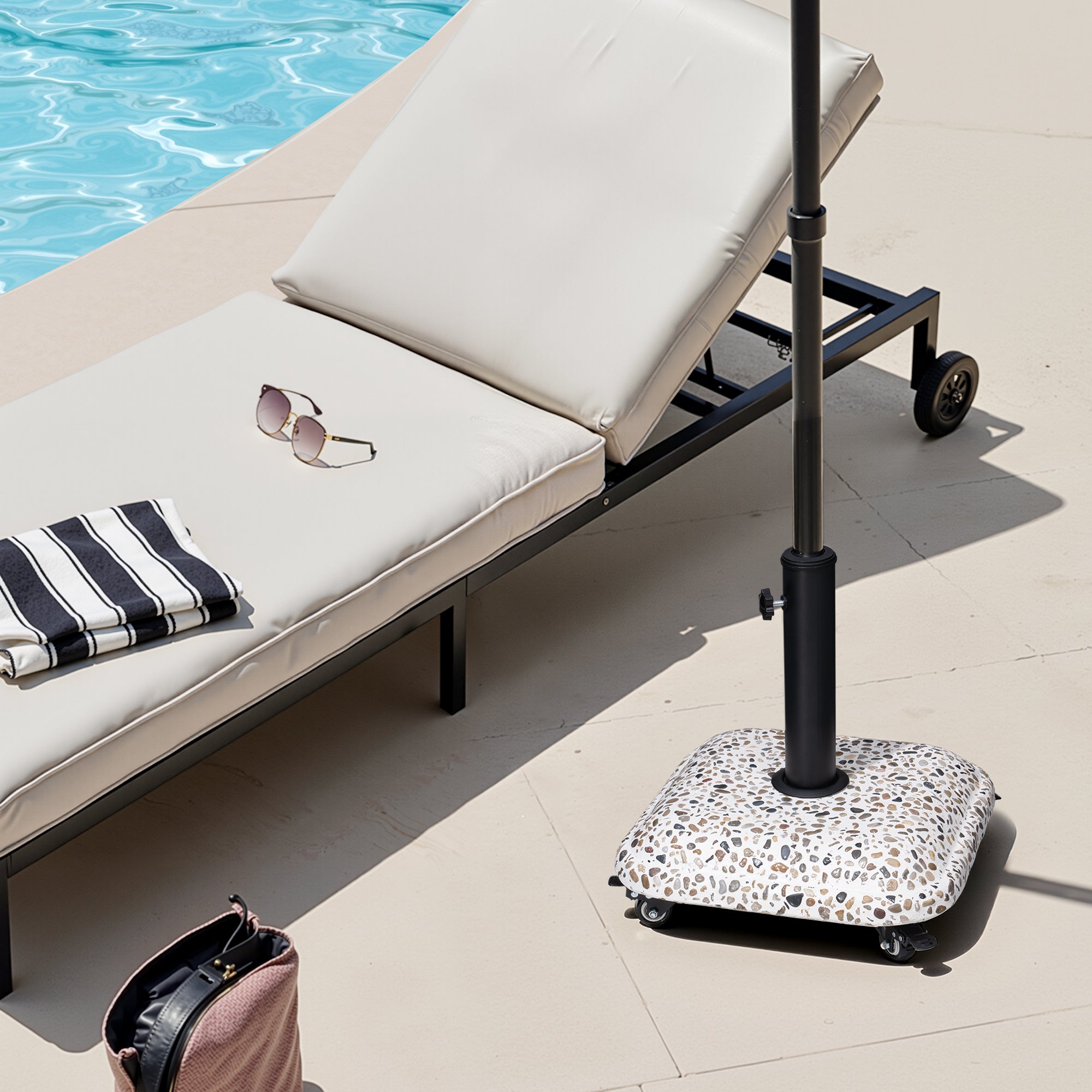 In-ground umbrella base with black steel pole and speckled wheeled base