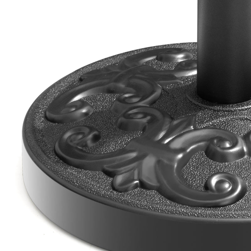 Black steel umbrella base top with ornate scrollwork and textured edge.