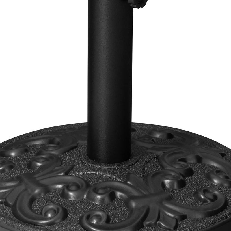 Umbrella base top disc with central pole opening, textured black finish.