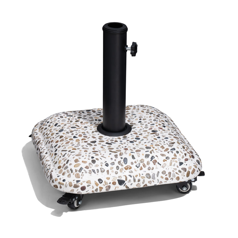 Umbrella base with black pole and speckled top on caster wheels