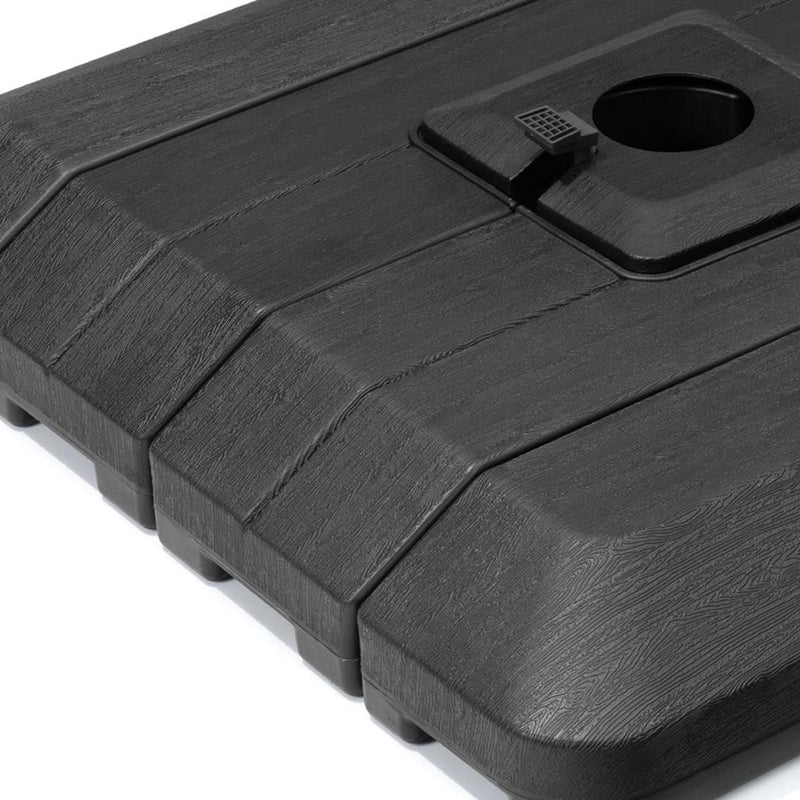 Black umbrella base with textured surface and central round pole hole