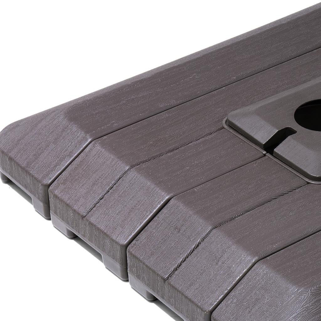 Textured dark gray umbrella base with central opening cutout and lever notch