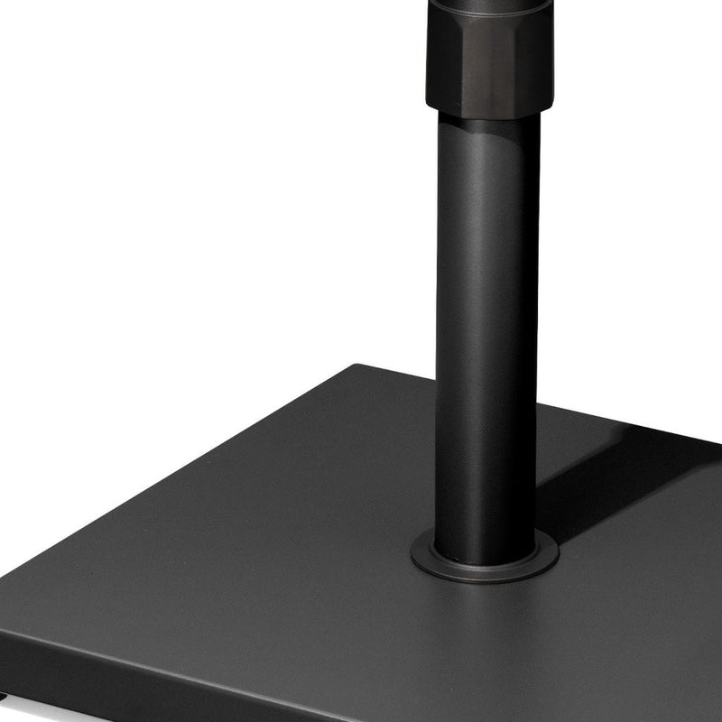 Black steel umbrella base pole with circular collar on square platform