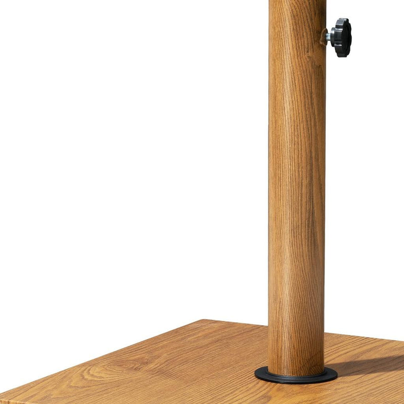 Wood-toned umbrella base pole with black adjustment collar and flat square base