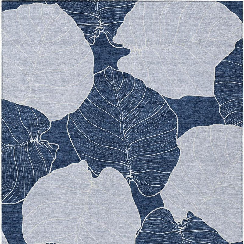 Navy and ivory leaf floral area rug, full pattern view with overlapping leaves.