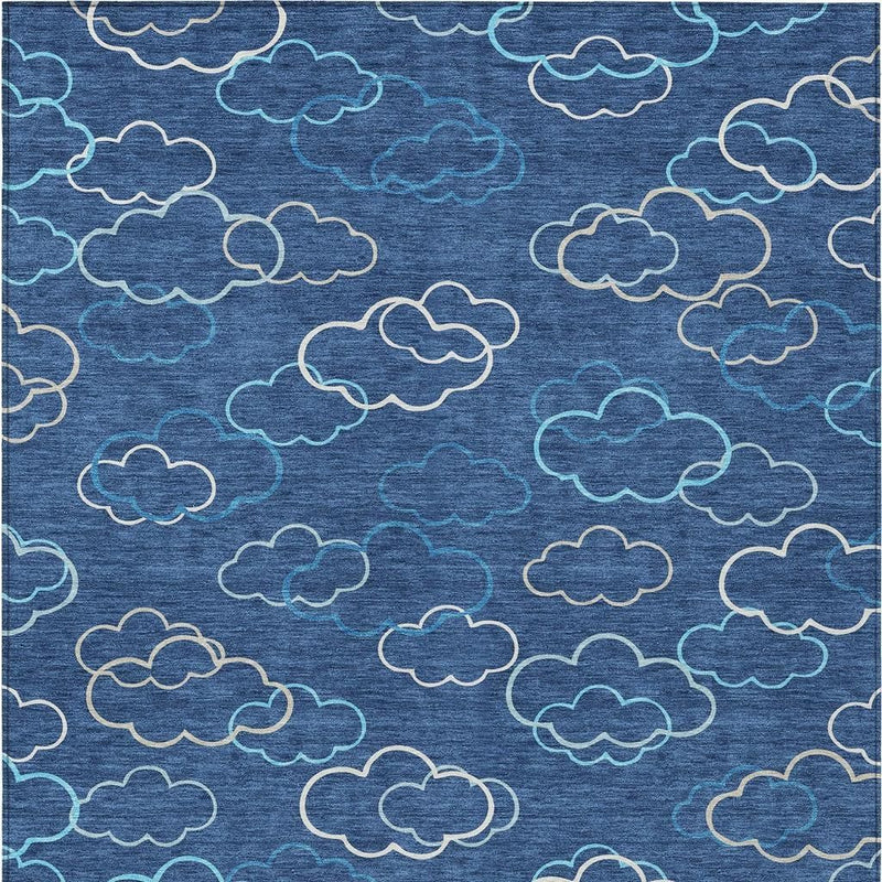 Navy area rug with scattered teal and ivory cloud line pattern, close-up