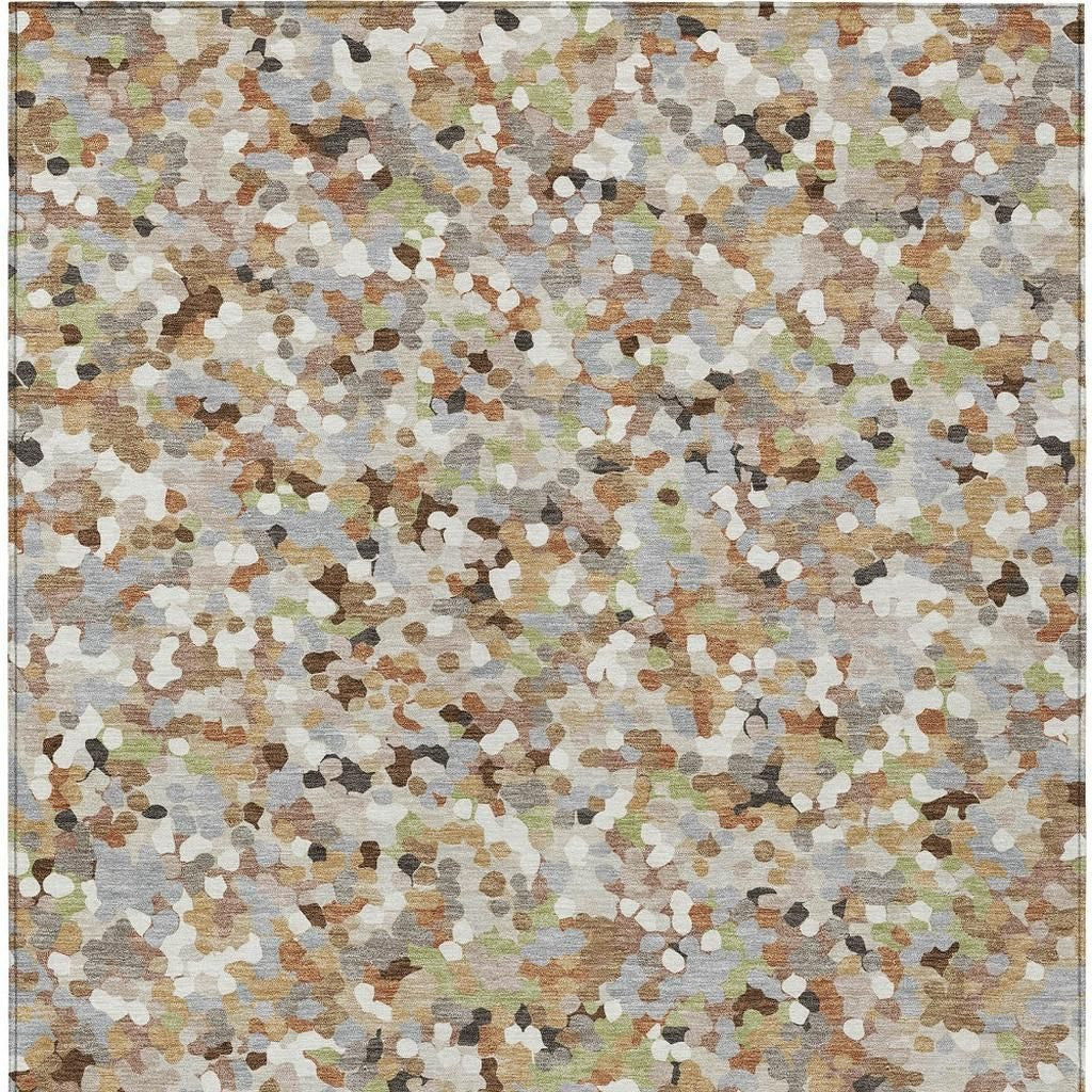 Beige and gray geometric area rug with multicolor speckled pattern, tight top view