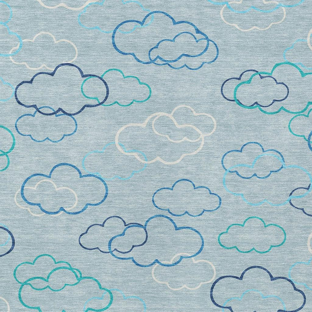 Sky blue rug with multicolor cloud outlines in navy, teal, and light grey