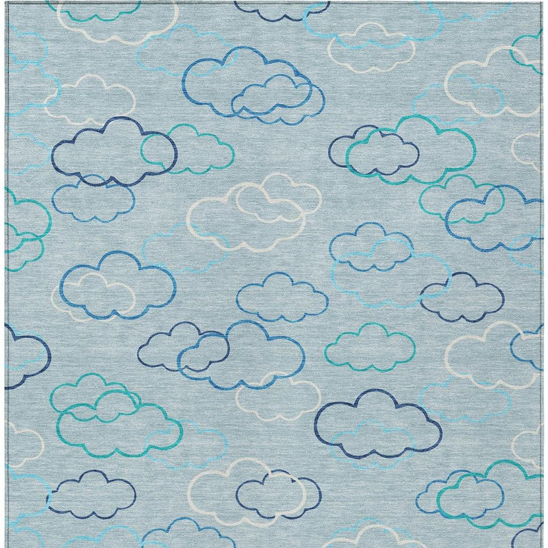 Sky blue area rug with navy and teal cloud line pattern, washable indoor outdoor