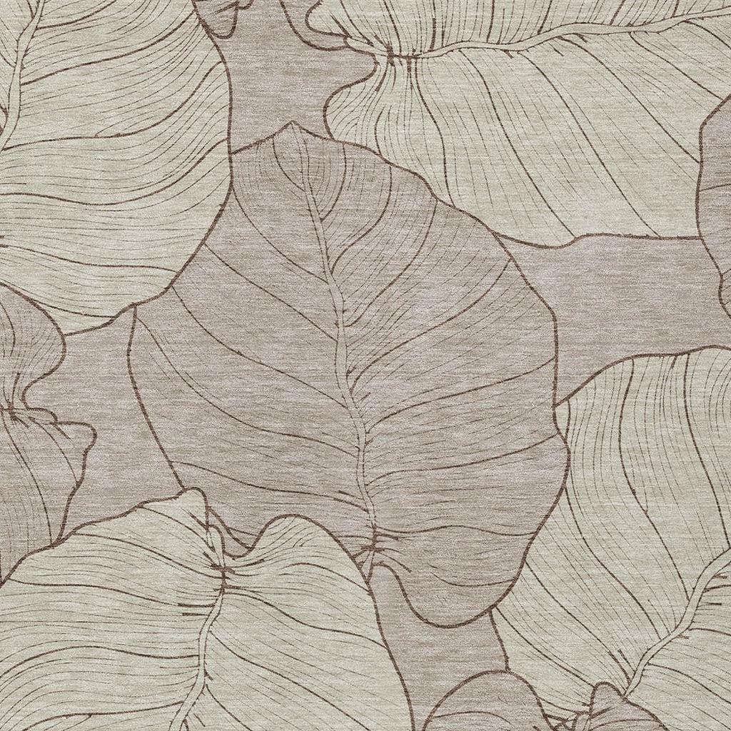 Taupe and beige leaf floral area rug, angled close-up of pattern