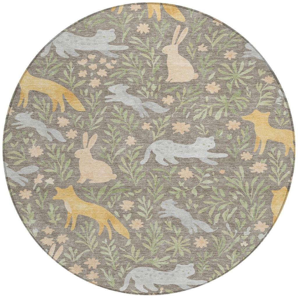 Taupe round area rug with forest animals and botanical leaves in muted green and gold