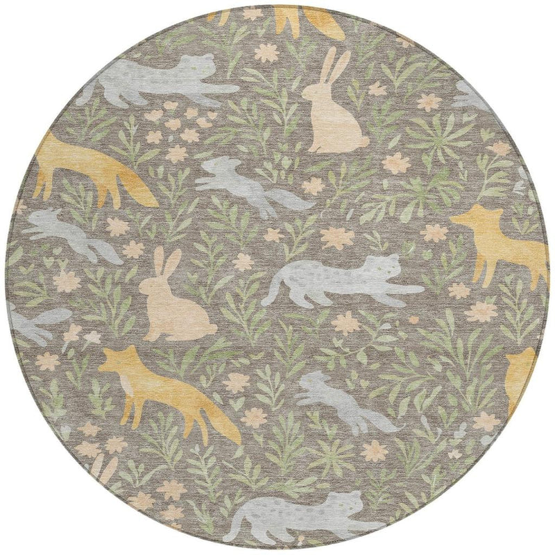 Taupe round area rug with forest animals and botanical leaves in muted green and gold