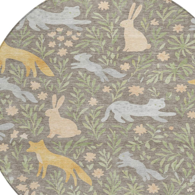 Round rug close-up: taupe base with green leaves and cream/gray animal silhouettes