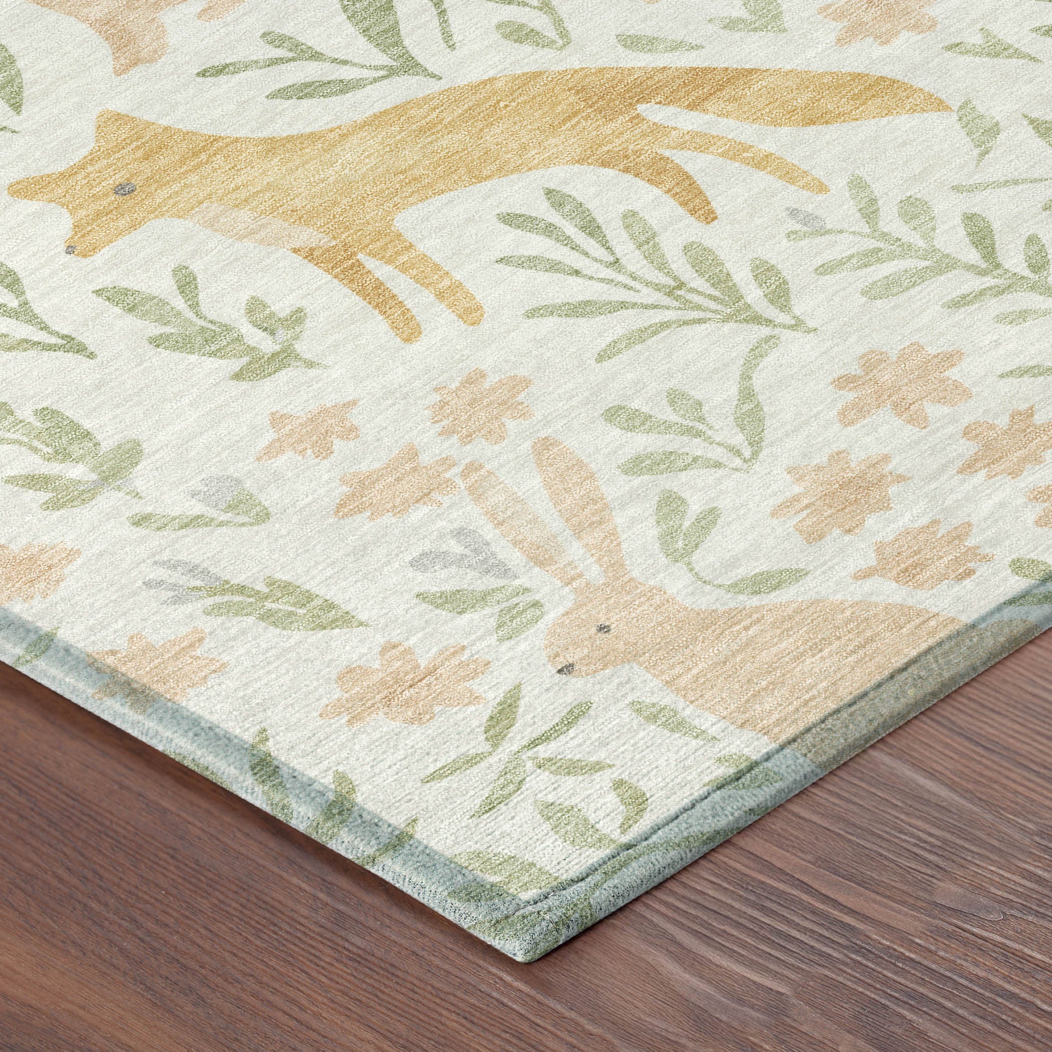 Ivory area rug with pink and green botanical leaf pattern and corner edge detail