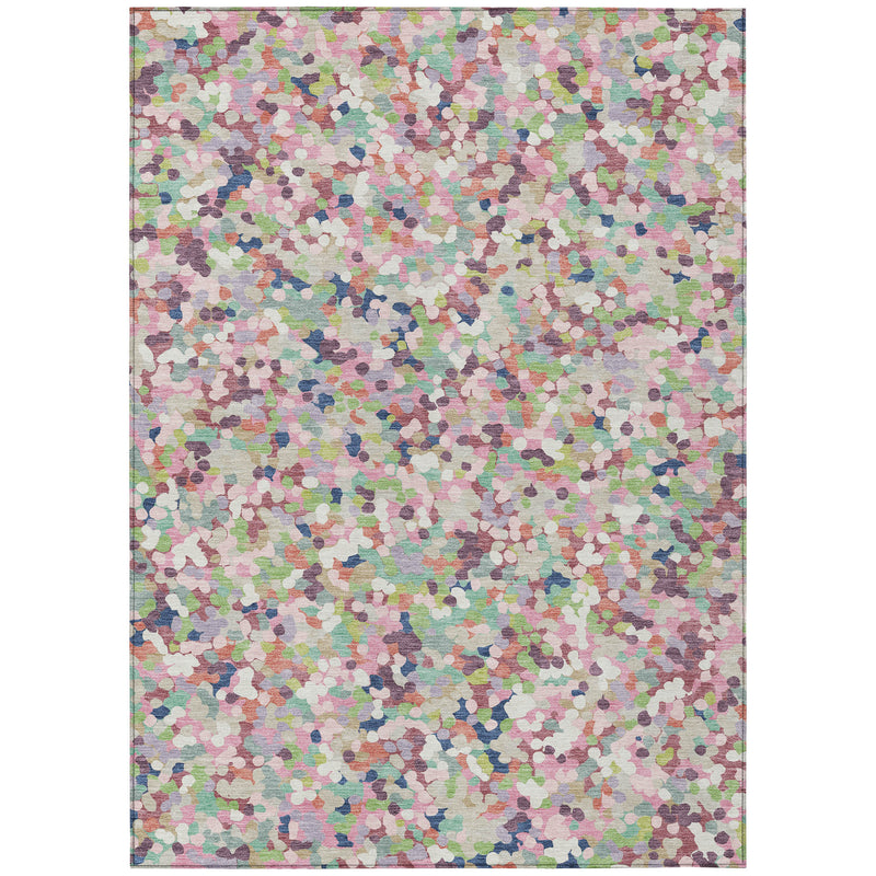 Indoor/outdoor area rug with multicolor speckled geometric pattern in pastel tones